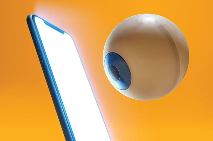ilustração de globo ocular em frente a uma tela de celular
